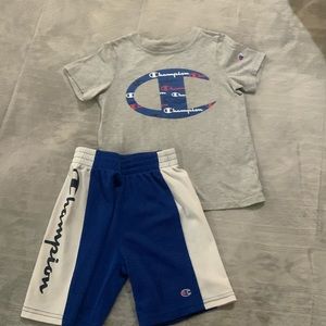 Blue, red and white Champion shirt and shorts matching set.